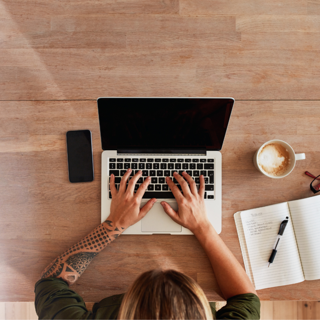 Woman typing on a laptop